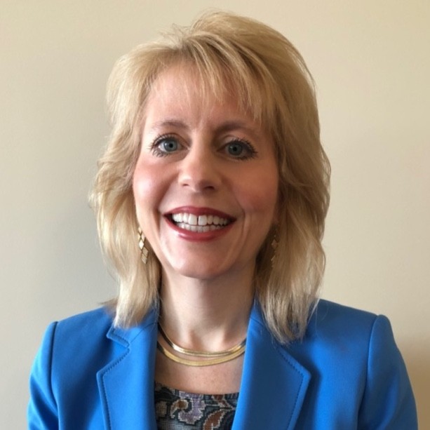 Ann Kuzee, TELUS Health’s Senior Legal Counsel, U.S. and Canadian Absence & Disability Management seen with a bright smile on her face